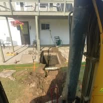 Basement waterproofing excavation exposing foundation walls in Grey County Ontario